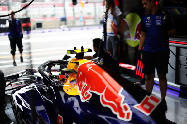 Isack Hadjar in the Red Bull pits at Circuit de Spa-Francorchamps. Grid penalties for unapproved power unit changes mean Hadjar will start from the back at the 2026 F1 Belgian GP.