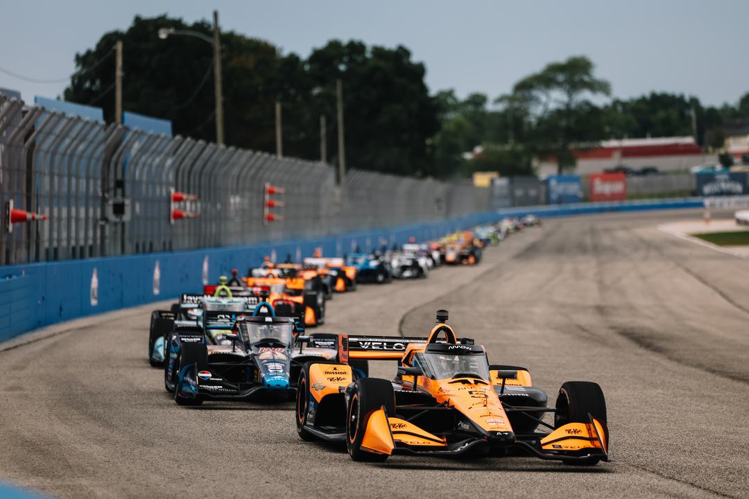 O’Ward completes a Milwaukee sweep as Palou seals his fifth IndyCar title after a rain-delayed Race 1 thriller.