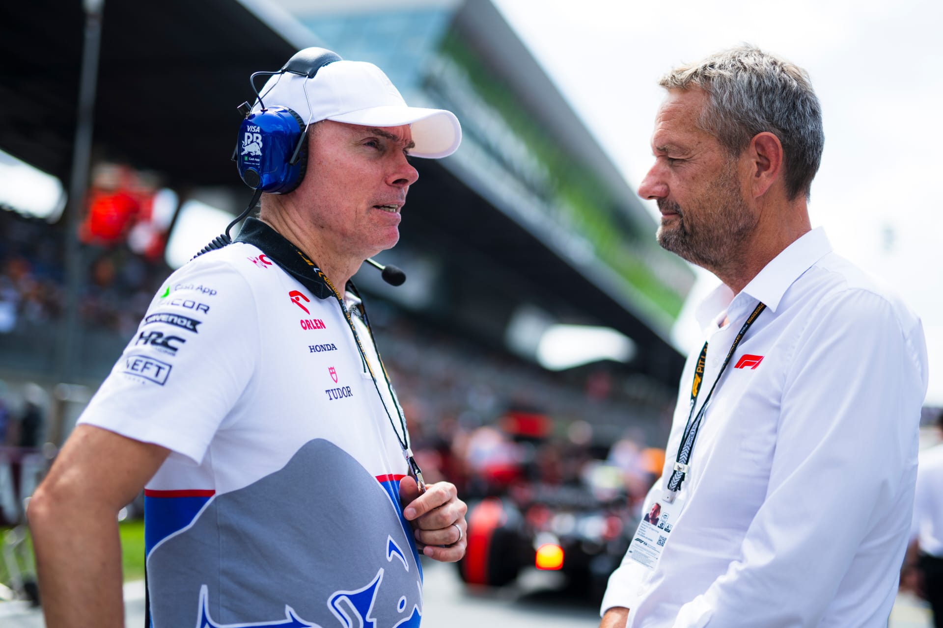 Alan Permane, Racing Director at Visa Cash App RB talks with Steve Nielsen, F1 Sporting Director on the grid prior tothe F1 Grand Prix of Austria at Red Bull Ring on June 30, 2024 in Spielberg, Austria