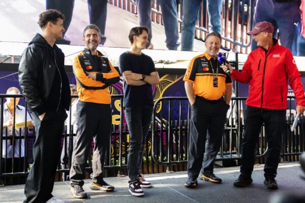 Zak Brown, Andrea Stella, Lando Norris and Oscar Piastri on stage giving interviews ahead of 2026 F1 Australian GP