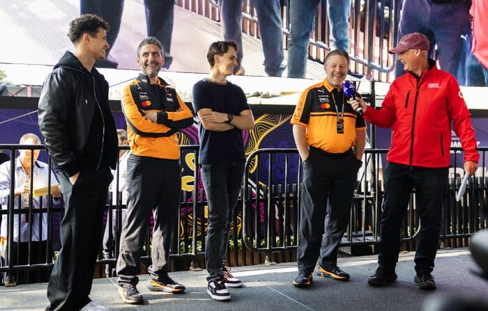 Zak Brown, Andrea Stella, Lando Norris and Oscar Piastri on stage giving interviews ahead of 2026 F1 Australian GP