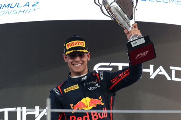 Campos Racing's Arvid Lindblad on the podium celebrating his P1 finish in the 2025 F2 Abu Dhabi GP Sprint Race.
