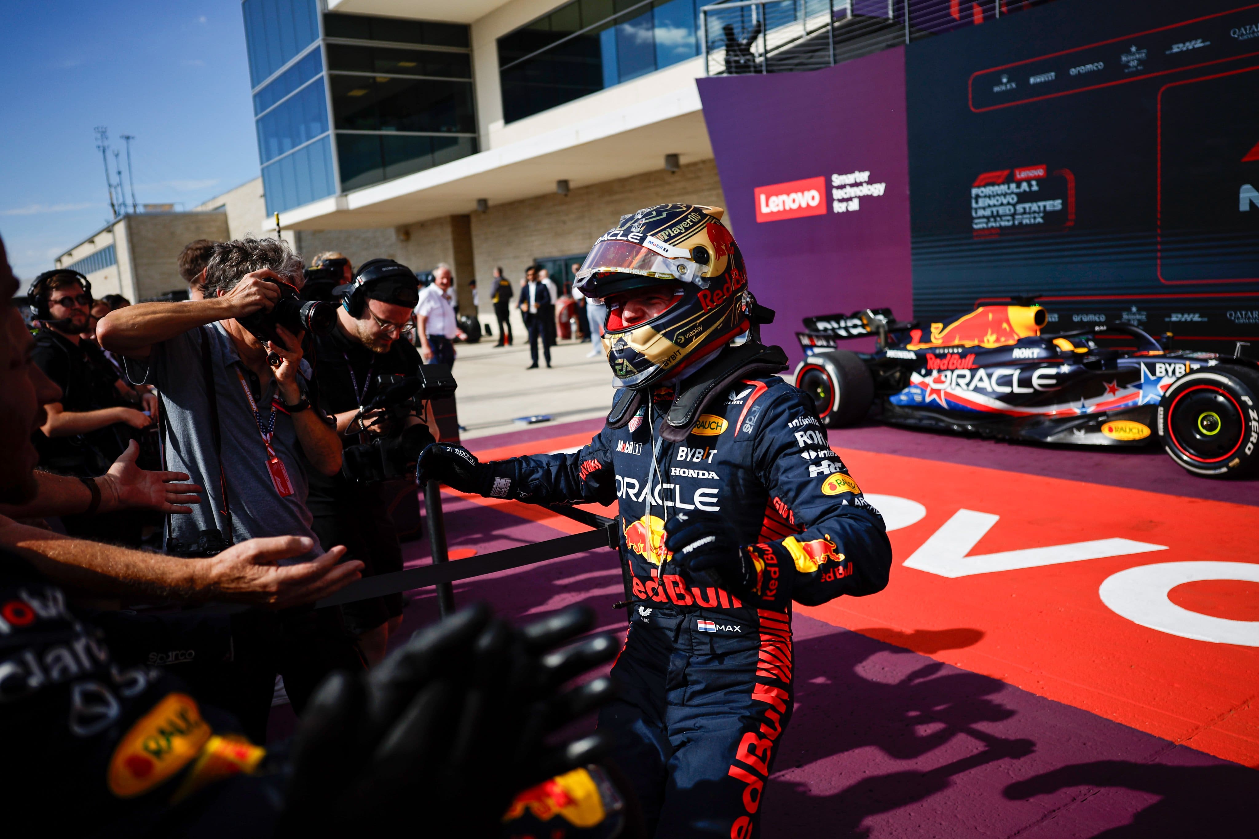 Max Verstappen celebrates with the Red Bull team as he claims his 15th victory of the 2023 season in COTA