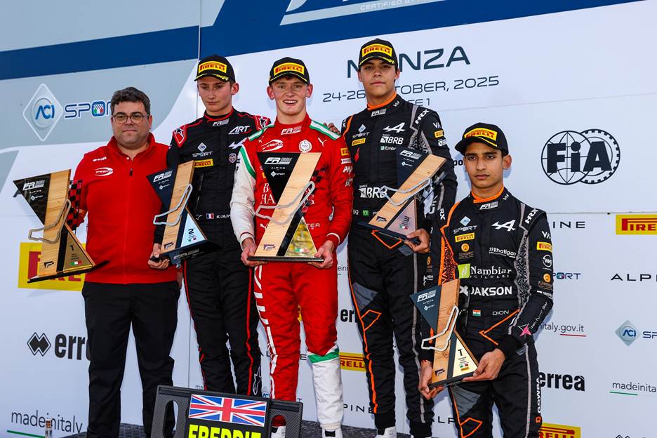 2025 FRECA Round 10 Race 1 Podium at Monza: Freddie Slater (P1) of Prema Racing, Evan Giltaire (P2) of ART Grand Prix, Pedro Clerot (P3) of Van Amersfoort Racing, and Dion Gowda (Rookie Champion) of Van Amersfoort Racing, with Prema Racing team representative