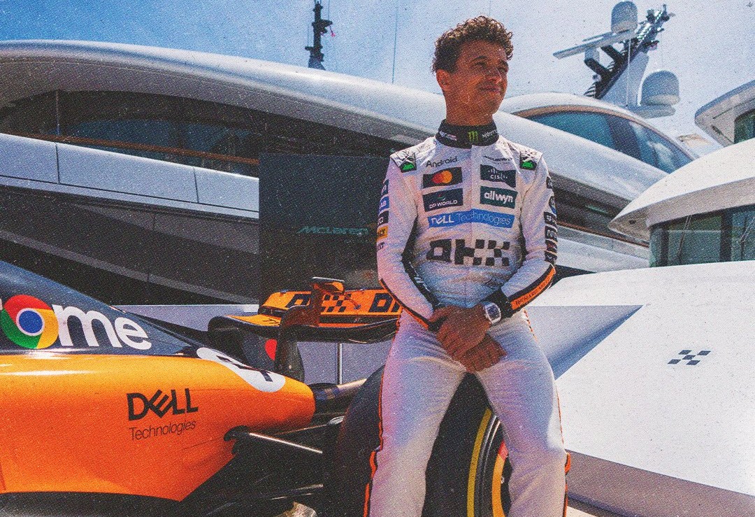 McLaren's Lando Norris sitting besides his car ahead of 2025 F1 Monaco GP