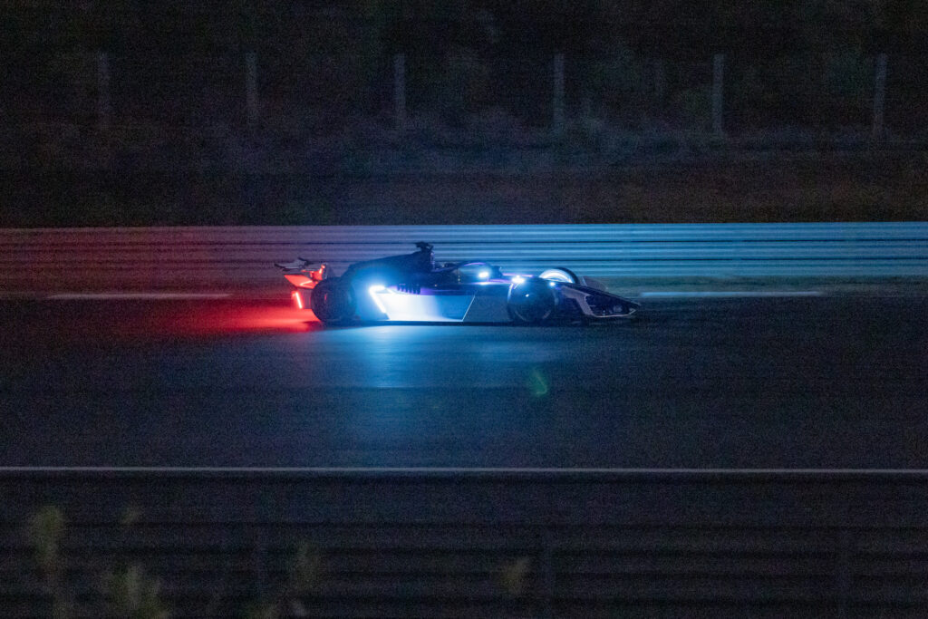 FIA Formula E GEN4 car from the side on a track in the dark