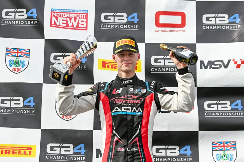 Luke Hilton claimed his maiden GB4 victory in Race 1 at Donington Park in 2026, holding off rookie Franciszek Cegielski after a Safety Car.