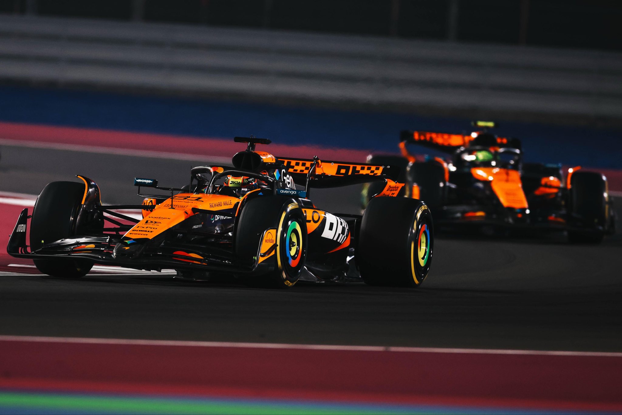 McLaren's Oscar Piastri and Lando Norris on track during the 2025 F1 Qatar GP.
