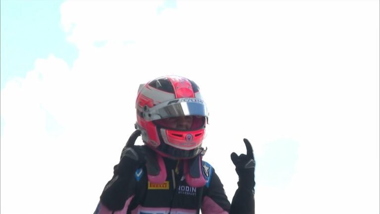 Abbi Pullin pointing two index fingers in the air after having won