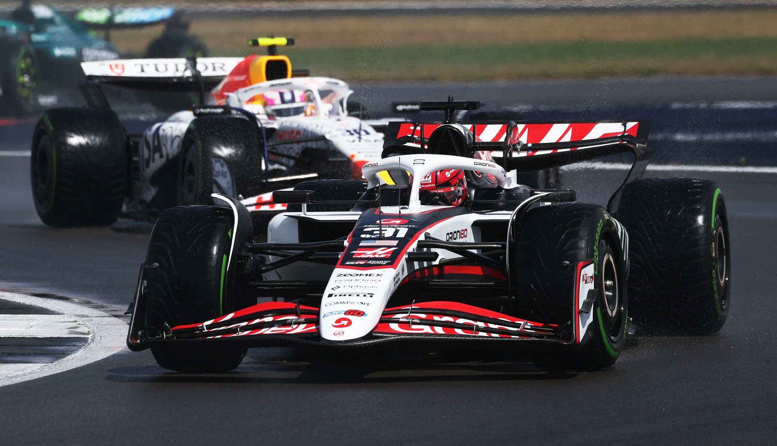 Haas' Esteban Ocon fighing on track at the F1 British GP race