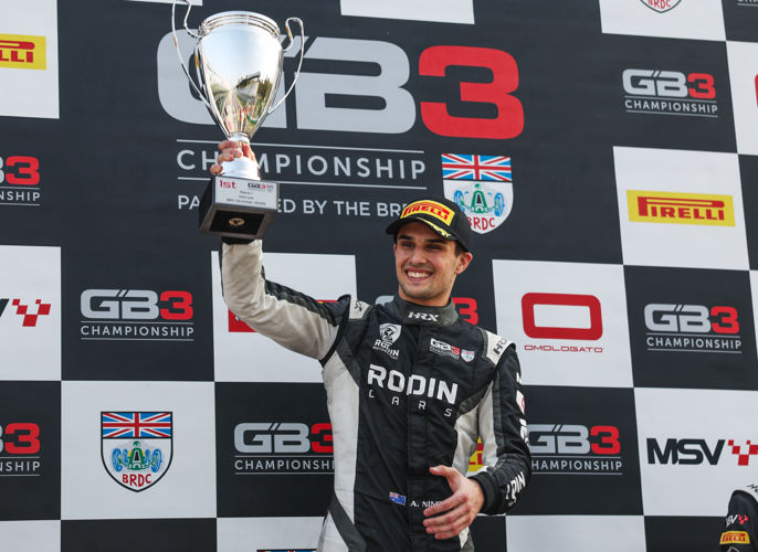 Alex Ninovic holds trophy after Race 1 win at Monza, his 9th of the 2025 GB3 Championship